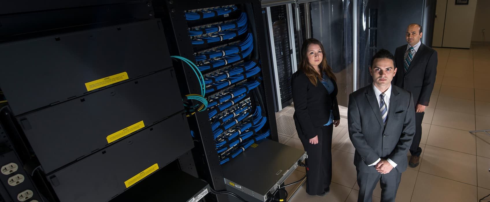 Mason students Liz Estes, Christian Donose, and Ram Bista, are founders of Cyber Security Systems, a Volgenau-based group to develop future cyber industry leaders. Photo by Evan Cantwell/Creative Services/George Mason University